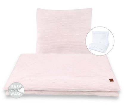 Weiches rosa Nestchen als Randschutz im Babybett